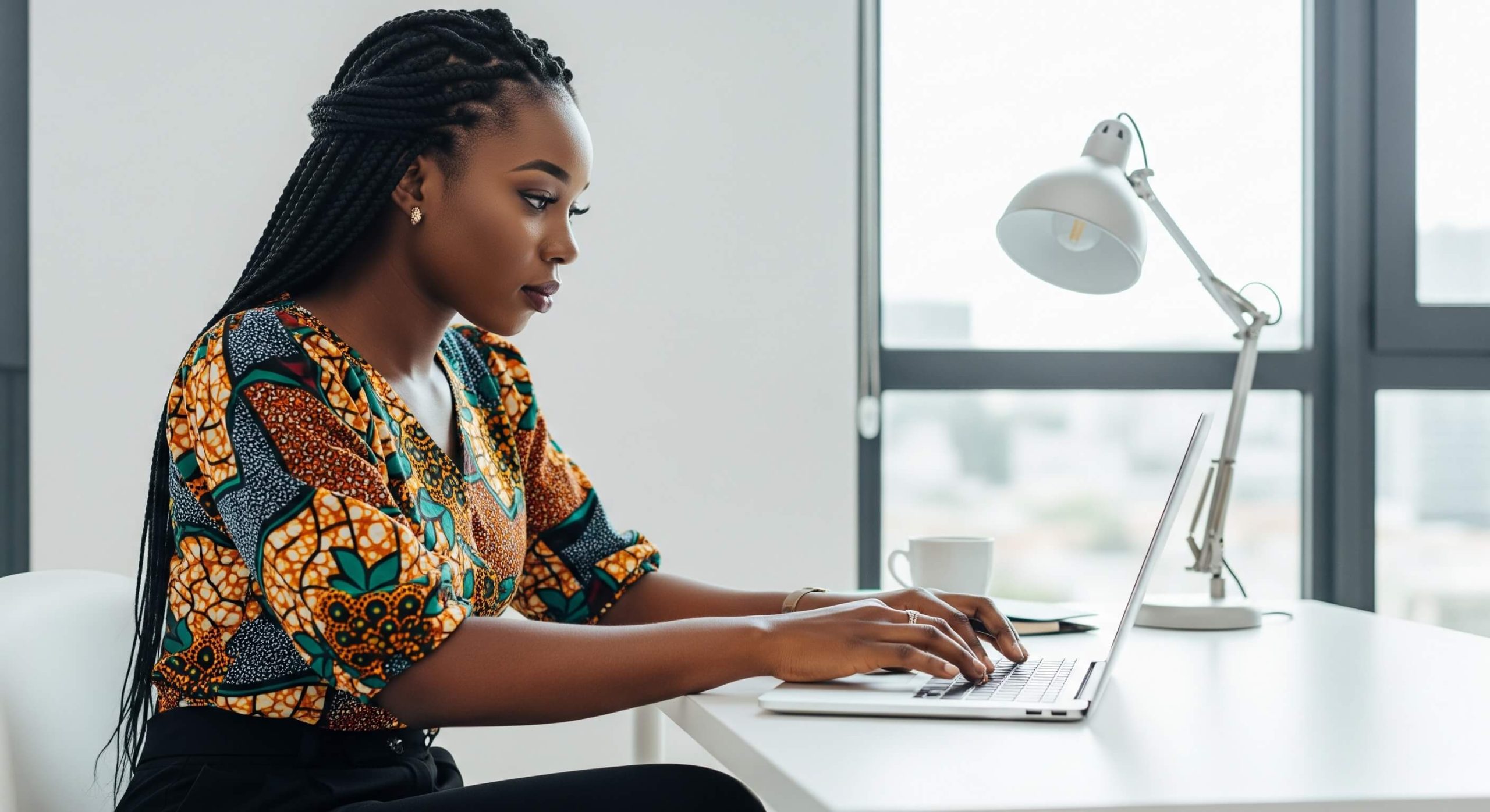 Adinkra spark _ Lady on computer